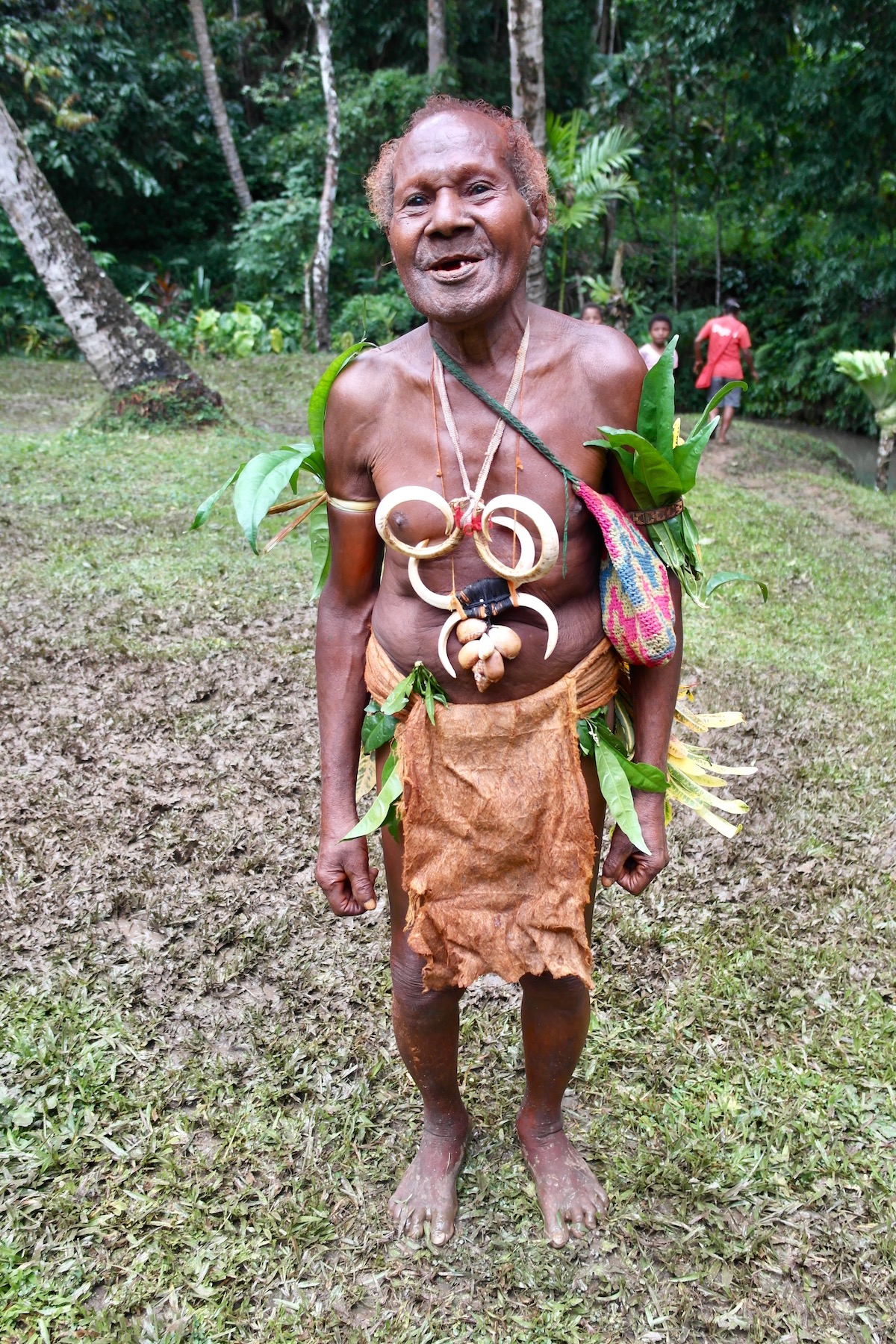 The Tribespeople of Papua New Guinea: A Detailed Guide | papua new guinea tribesman A tribesman in traditional indigenous attire smiles in Papua New Guinea