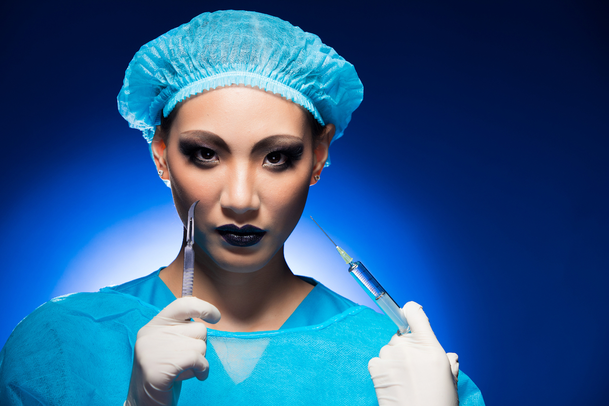 Plastic Surgery in Thailand, Broke & an Untimely Erection | scary plastic surgery nurse Thailand 1 A plastic surgery Doctor or Nurse in a hygiene suit, cap, glove, syringe and surgical knife acts scary