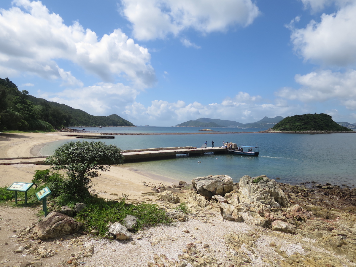 The Ultimate Hong Kong Bucket List: 25 Best Things To Do! | sharp island hong kong Pier looking towards a sea of other islands in Hong Kong