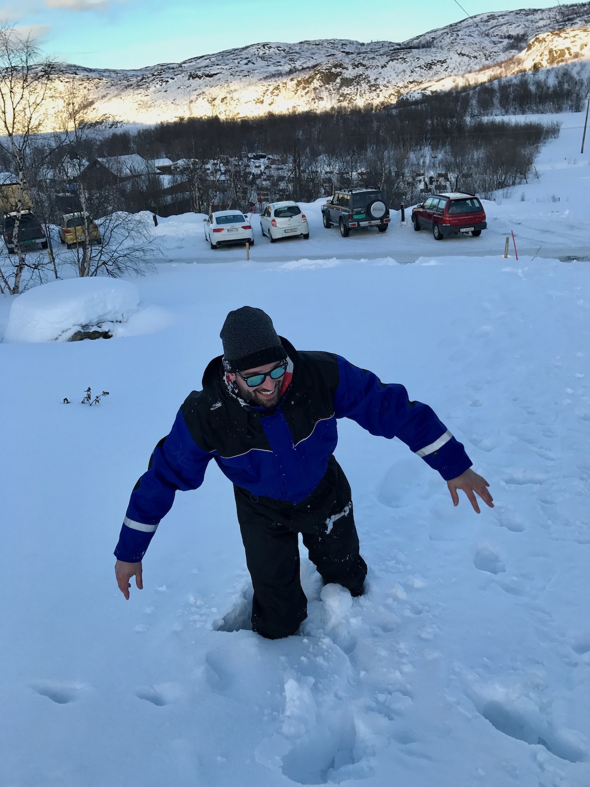 20 Brilliant Things To Do in Kirkenes (+ City Guide!) | snowhiking in kirkenes A man laughs while he is stuck in snow