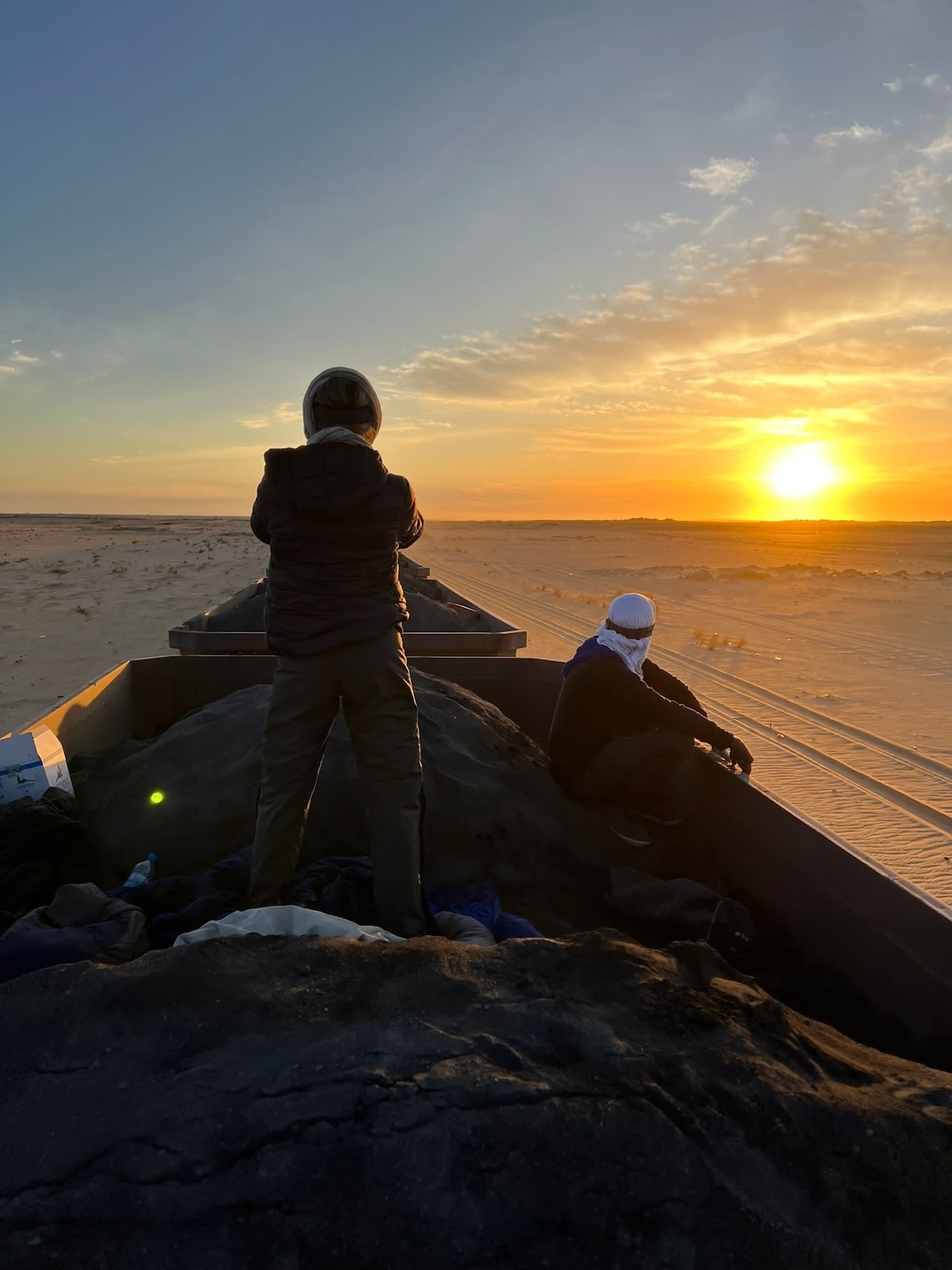 Riding The Iron Ore Train, Mauritania: My Sahara Experience! | sunrise iron ore train Mauitania Sunset views while riding the iron ore train in Mauritania