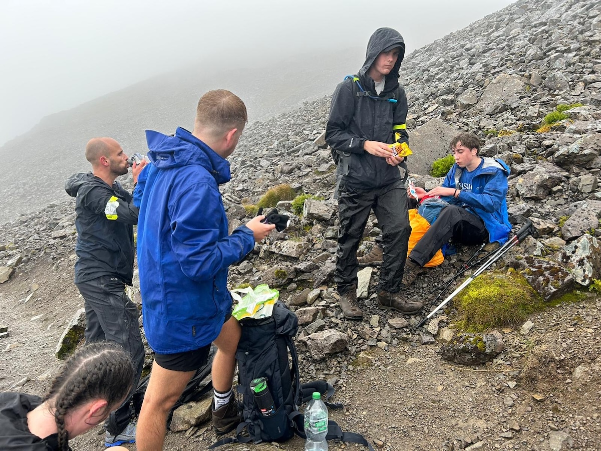 Hiking The UK National 3 Peaks in 24 Hours: An Honest Guide | three peaks challenge Hikers stop for food during the three peaks challenge