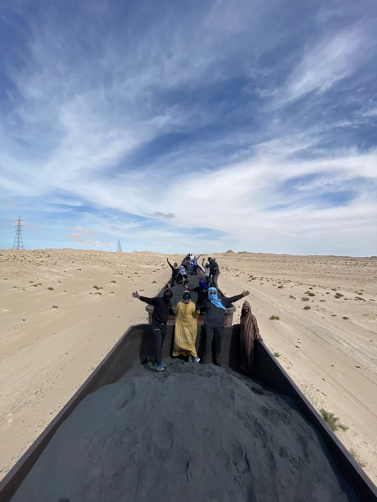 Riding The Iron Ore Train, Mauritania: My Sahara Experience! | tourists on iron ore train Mauritania Tourists in the Sahara Desert of Mauritania hitchhike on top of the famous iron ore train