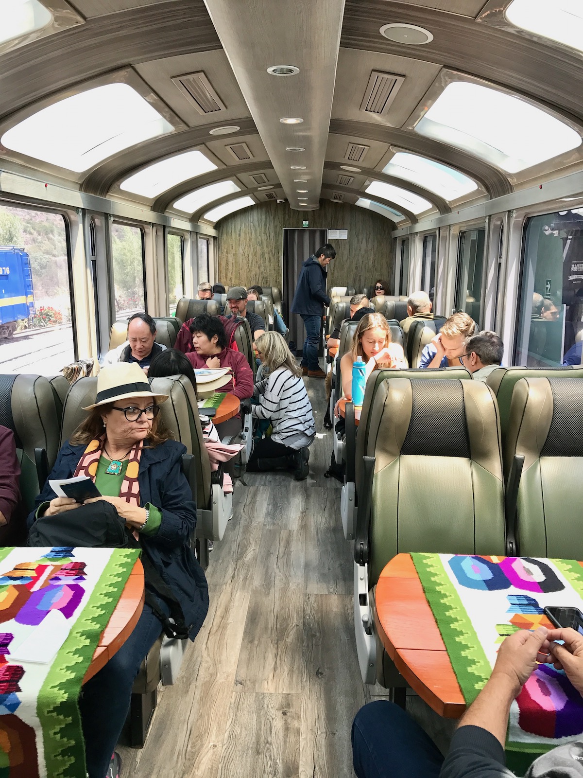 How To Get To Machu Picchu From Cusco (No Dramas, Only Llamas!) | train to Machu Picchu Train passengers en route to Machu Picchu in Peru