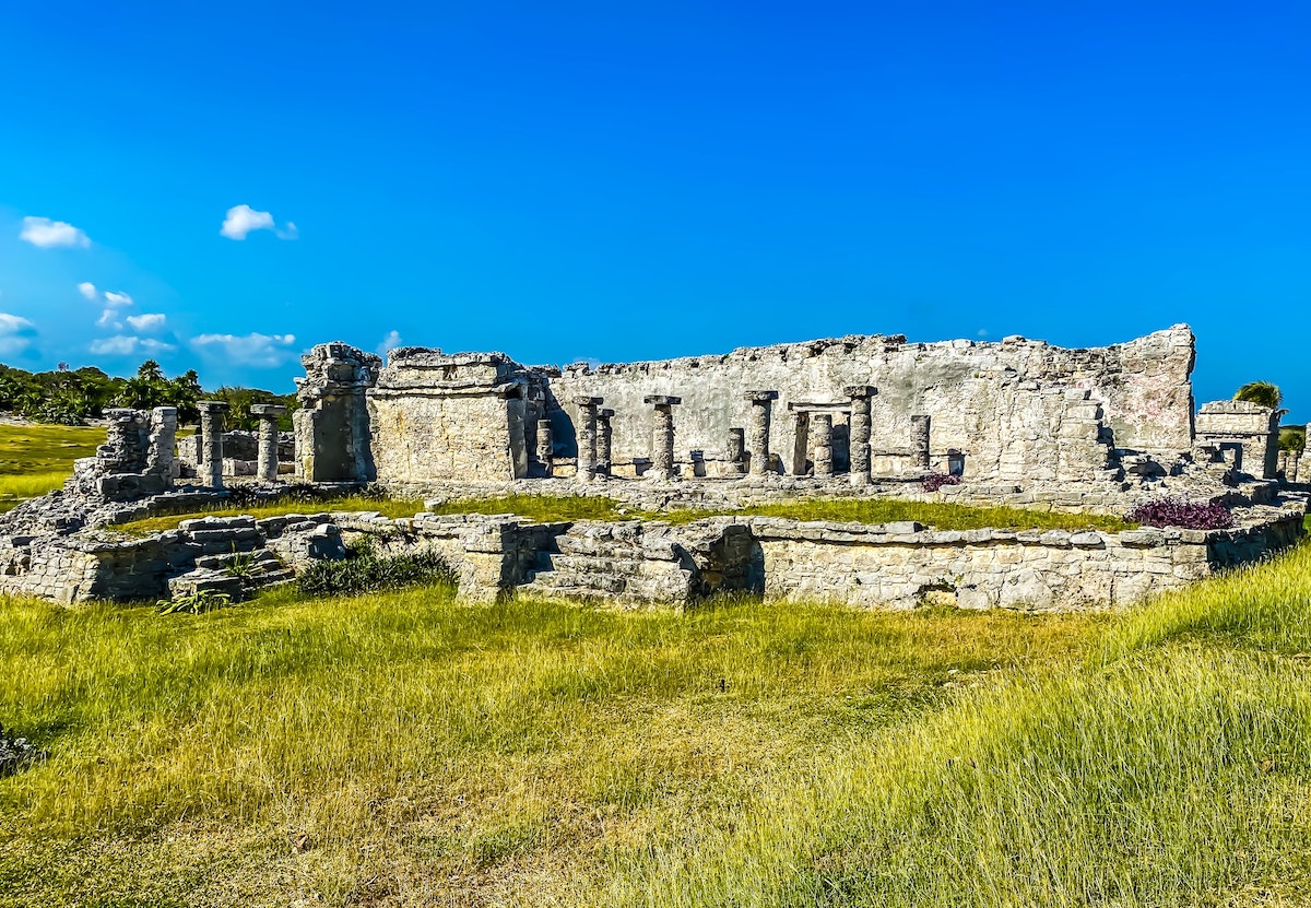 16 Famous Landmarks in Mexico (& How To See Them in 2024!) | tulum ruins Remains of an ancient building in Tulum.