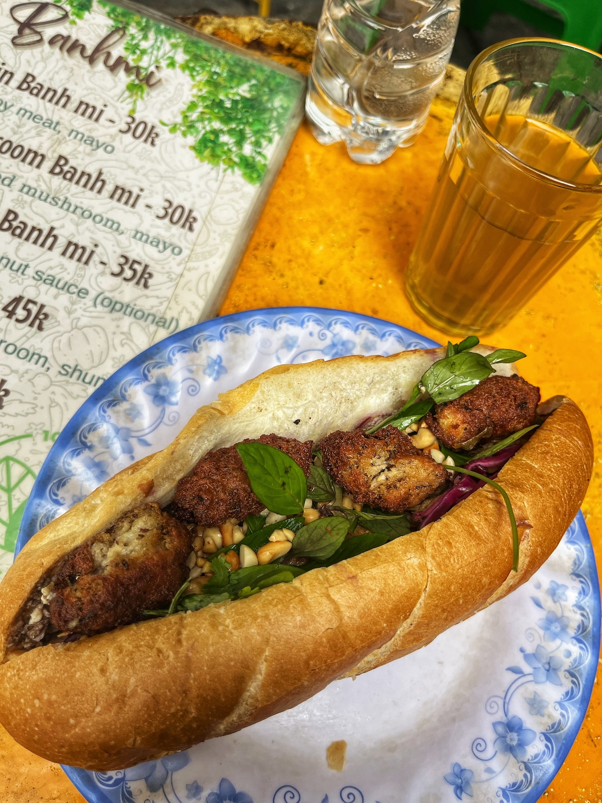 One Day in Hanoi Itinerary: No Transport Needed (Walking Only!) | vegan banh mi Hanoi An open sandwich baguette with faux meat, garlic, pine nuts and greens. Banh Mi is a staple lunch in Hanoi.